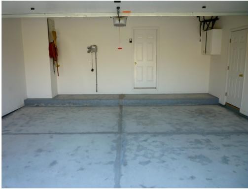Before epoxy flooring: old cracked concrete floor