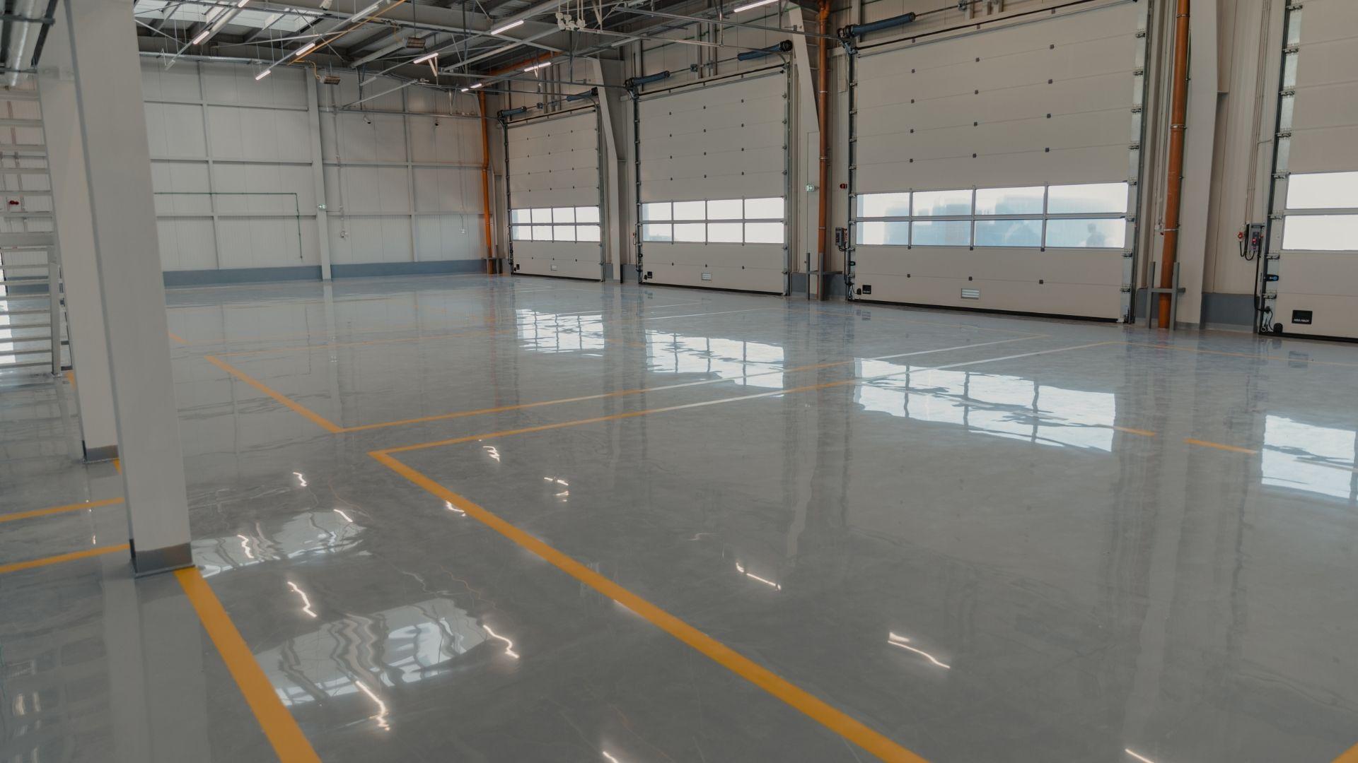 Warehouse epoxy flooring, industrial floor coating Ajman UAE